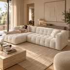 A woman lying full length on the chaise of the Cloud Corner Sectional in Cloud White, chaise left, with room to spare