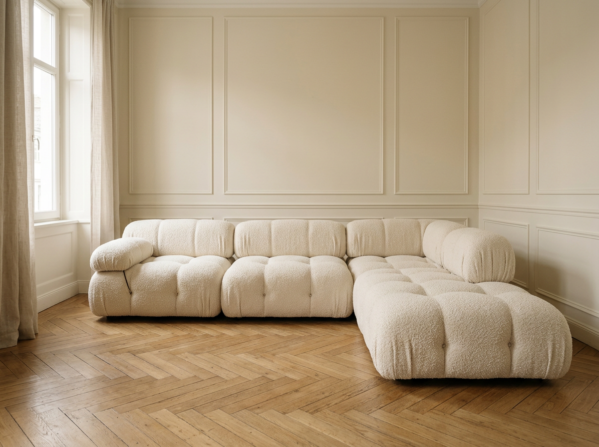 The AP-27 corner sofa in Cloud White bouclé, in place along the wall