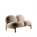 The Nest two-seater loveseat in oatmeal bouclé