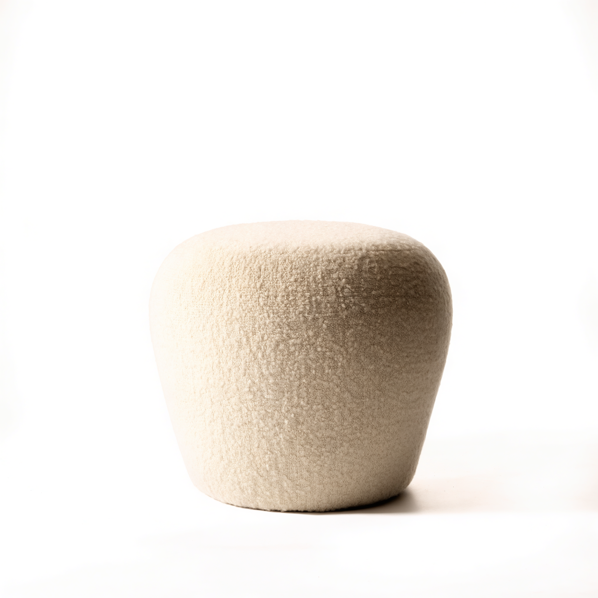 The Pebble upholstered stool in oatmeal bouclé