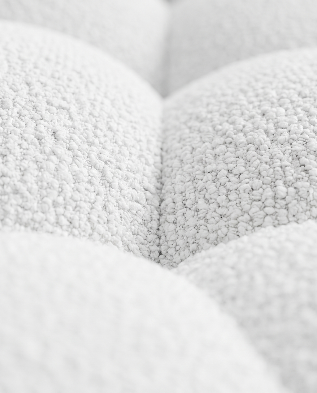 Close-up of the white looped bouclé upholstery