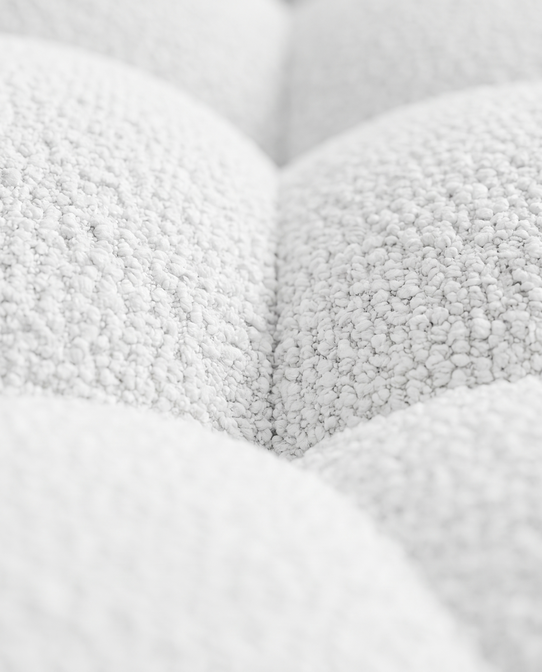 Close-up of the white looped bouclé upholstery