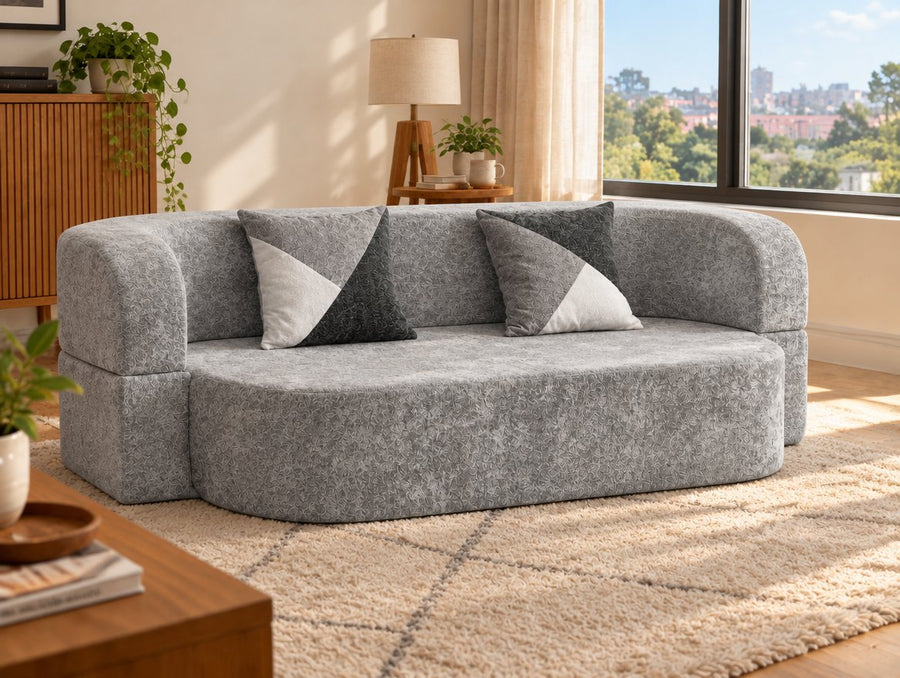 Arc Sofa Bed in Silver Gray as a sofa during the day