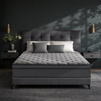 Rest Hybrid Mattress on a gray upholstered bed